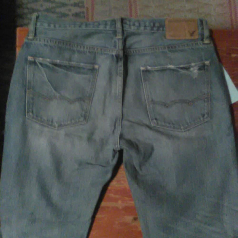 American Eagle light blue rip/fade design